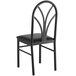 A Lancaster Table & Seating black metal chair with a black cushion.