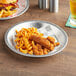 A silver aluminum Choice serving platter with fried chicken and fries on it.