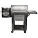 A black and silver Louisiana Grills LG800FL Founders Legacy 800 Pellet grill with a stainless steel tray.