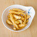 A Blue Bamboo melamine saucer filled with fried chicken strips on a table.