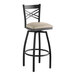 A black Lancaster Table & Seating swivel bar stool with a light gray cushion.