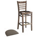 A Lancaster Table & Seating wood ladder back bar stool with a detached taupe vinyl seat.