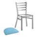 A Lancaster Table & Seating stainless steel ladder back chair with a blue vinyl padded seat.