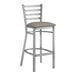 A Lancaster Table & Seating clear coat finish ladder back bar stool with a dark gray cushioned seat.