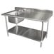 A stainless steel work table with a sink on the left and a shelf.