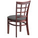 A Lancaster Table & Seating mahogany wood window back chair with dark gray vinyl seat.