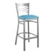 A Lancaster Table & Seating metal cross back bar stool with a blue vinyl padded seat.