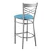 A Lancaster Table & Seating metal bar stool with a blue vinyl padded seat.