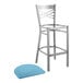 A Lancaster Table & Seating metal bar stool with a blue cushion.