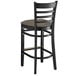 A Lancaster Table & Seating black wood bar stool with a taupe seat.