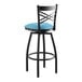 A black Lancaster Table & Seating swivel bar stool with a blue vinyl padded seat.