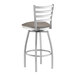 A Lancaster Table & Seating swivel bar stool with a dark gray cushion.
