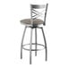 A silver Lancaster Table & Seating swivel bar stool with a dark gray cushion.