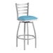 A Lancaster Table & Seating swivel bar stool with a blue vinyl cushion.