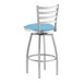 A Lancaster Table & Seating swivel bar stool with blue vinyl padding on the seat and backrest.