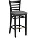 A Lancaster Table & Seating black wood ladder back bar stool with dark gray vinyl seat.