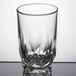 An Arcoroc clear juice glass with a diamond pattern.
