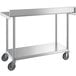 A silver Regency stainless steel work table with wheels.