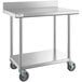A Regency stainless steel work table with undershelf and casters.