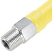 A yellow T&S Safe-T-Link gas appliance connector with a stainless steel nozzle.