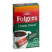 A box of Folgers Classic Decaf Instant Coffee packets on a white background.