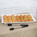 A white Siciliano rectangular tray with cookies on a table.