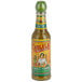 A close up of a bottle of Cholula Green Pepper Hot Sauce with a label on it.