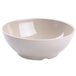 A white BambooMel bowl with a speckled surface.