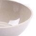 A close up of a GET Melamine Bamboo bowl with a white speckled design.