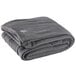 A folded charcoal gray Oxford fleece blanket.