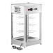 A white and silver ServIt countertop pizza warmer with a glass door and wire racks.