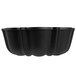 A black non-stick fluted bundt cake pan with curved edges.