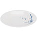 A white Thunder Group Blue Bamboo melamine plate with blue designs on a table.