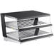 A black and silver ServIt countertop heated display warmer with two slanted shelves.
