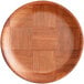 A Choice woven wood plate with a checkered pattern.