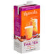 A carton of Thaiwala Unsweetened Thai Tea concentrate with a glass of orange liquid.