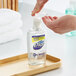 A person using Dial Sensitive Skin Antibacterial Liquid Hand Soap to wash their hands.