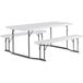 A white rectangular Lancaster Table & Seating plastic picnic table with attached benches.