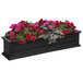 A Mayne Fairfield black rectangular window box with pink and red flowers.