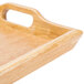 A natural hardwood room service tray with handles.