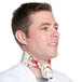 A man wearing an Intedge apple patterned chef neckerchief around his neck.