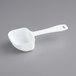 A white plastic measuring spoon.