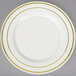 A Fineline Silver Splendor ivory plastic plate with gold bands on the rim.