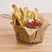A basket of french fries with ketchup on a white background.