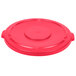 A red plastic lid for a Rubbermaid BRUTE trash can.