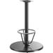 A Lancaster Table & Seating black metal bar height table base with a round column and foot ring.
