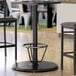 A Lancaster Table & Seating black bar height table base with a foot ring.