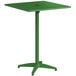 A green Lancaster Table & Seating bar height outdoor table with a metal base and umbrella hole.