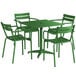 A green metal table with chairs and an umbrella hole.