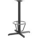 A black table with a Lancaster Table & Seating bar height metal column base and foot ring.